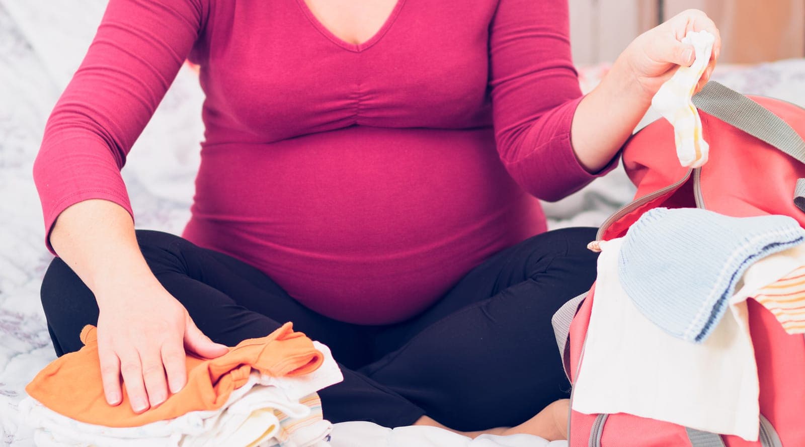 Pregnant mother packing her hospital bag