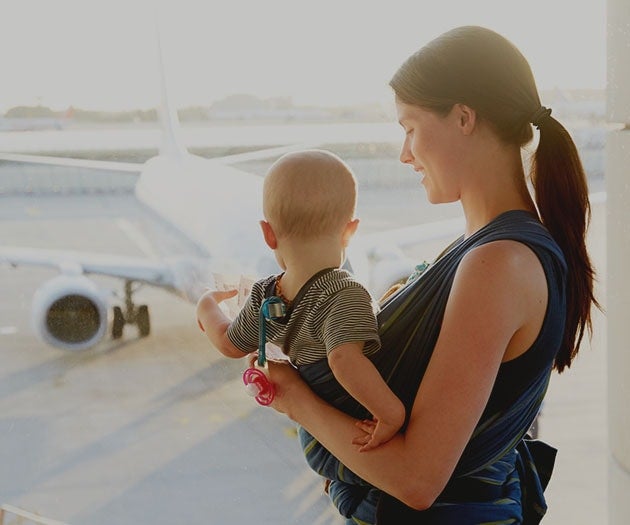 mother travelling with baby at the airport